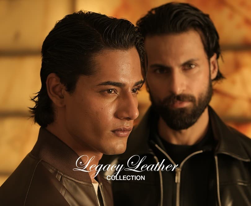 Team celebrating around a laptop in a modern office